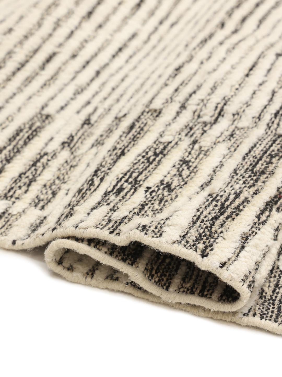 Hand-knotted wool rug with geometric patterns in beige and grey from Afghanistan