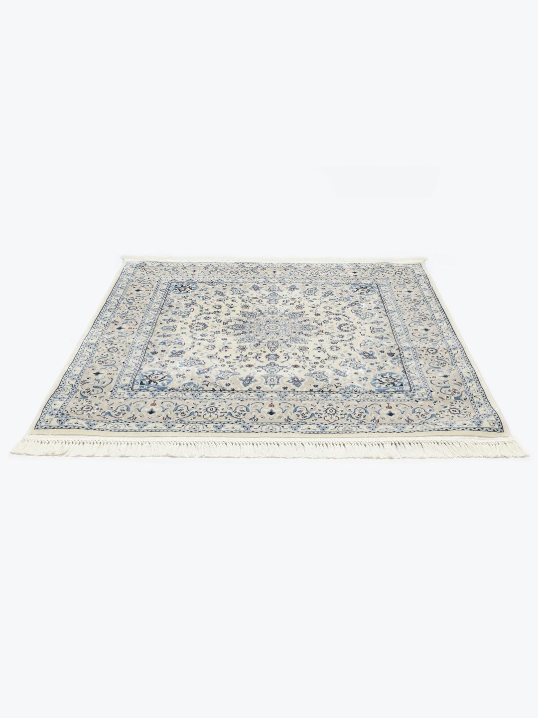 Vierkant tapijt met beige en lichtblauwe bloemmotieven