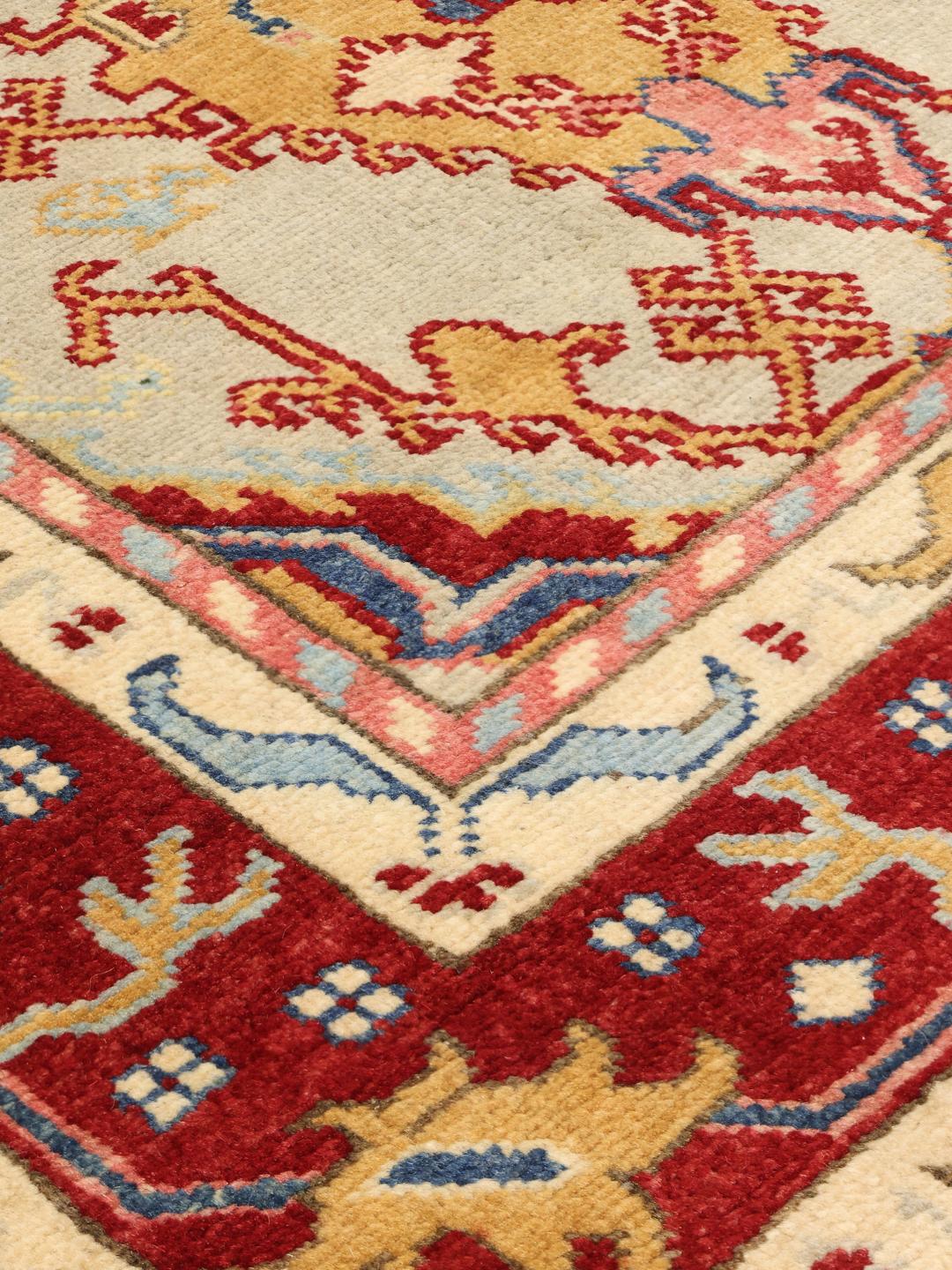 Tapis afghan Kazak noué à la main avec un motif géométrique multicolore