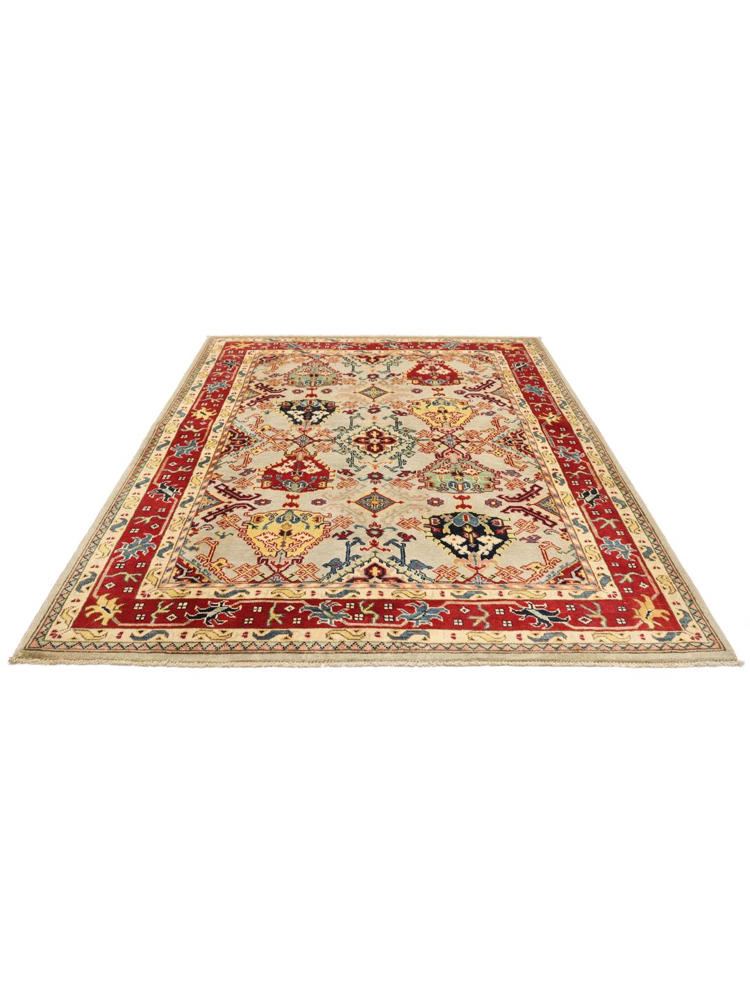 Tapis afghan noué à la main avec des motifs géométriques colorés sur un fond clair