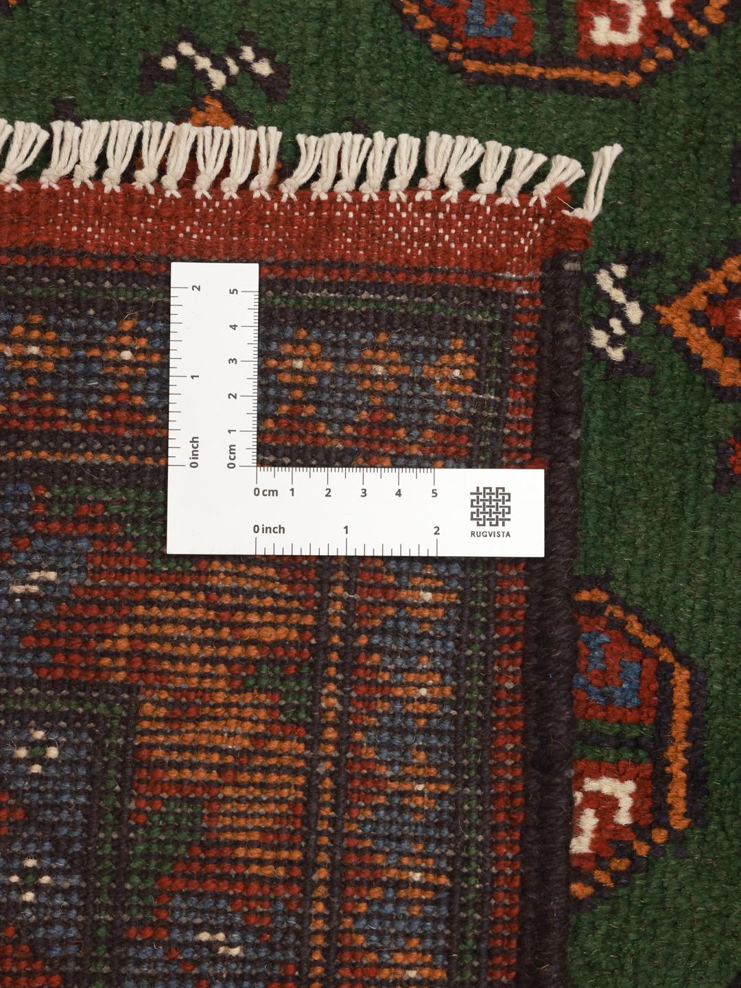 Håndknyttet Afghan Akhche-tæppe med en dybgrøn flade og traditionelle geometriske motiver.