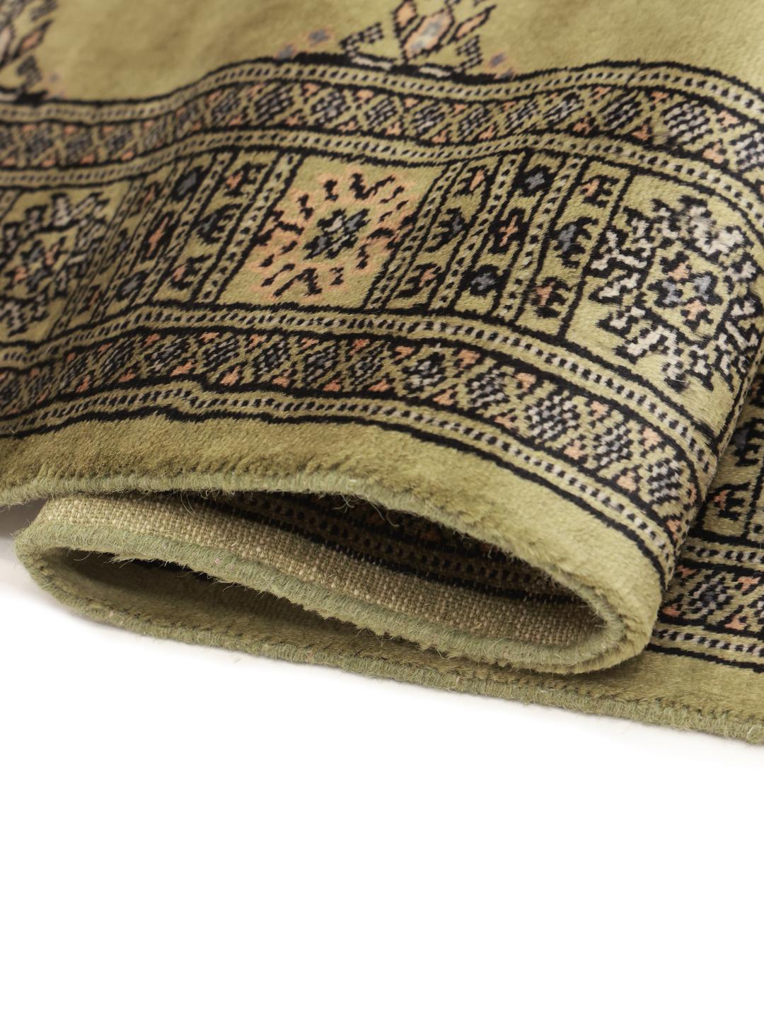 Hand-knotted Pakistan Bokhara runner in green with geometric motifs