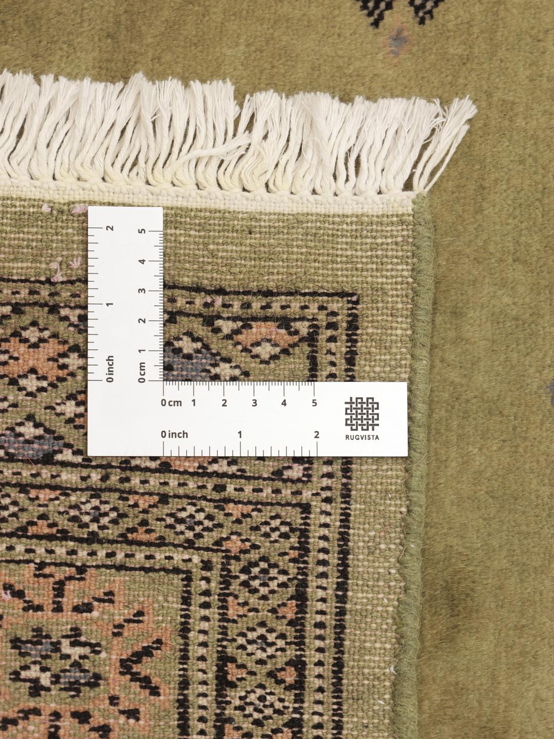 Hand-knotted Pakistan Bokhara runner in green with geometric motifs