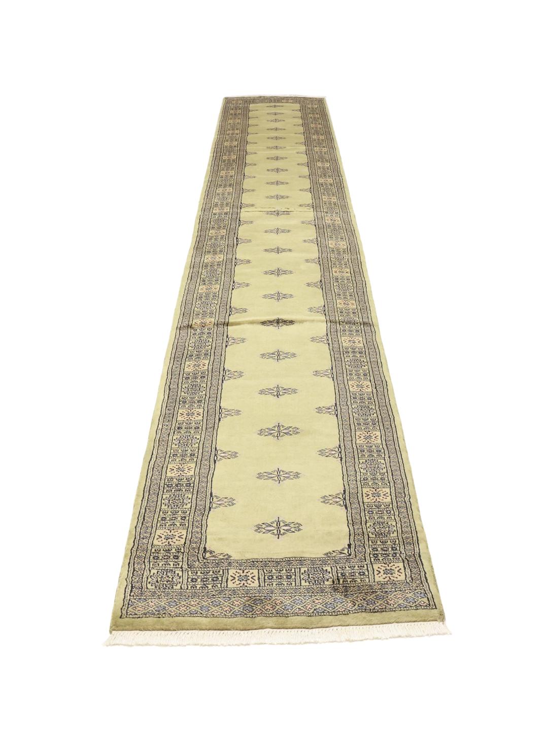 Hand-knotted Pakistan Bokhara runner in green with geometric motifs