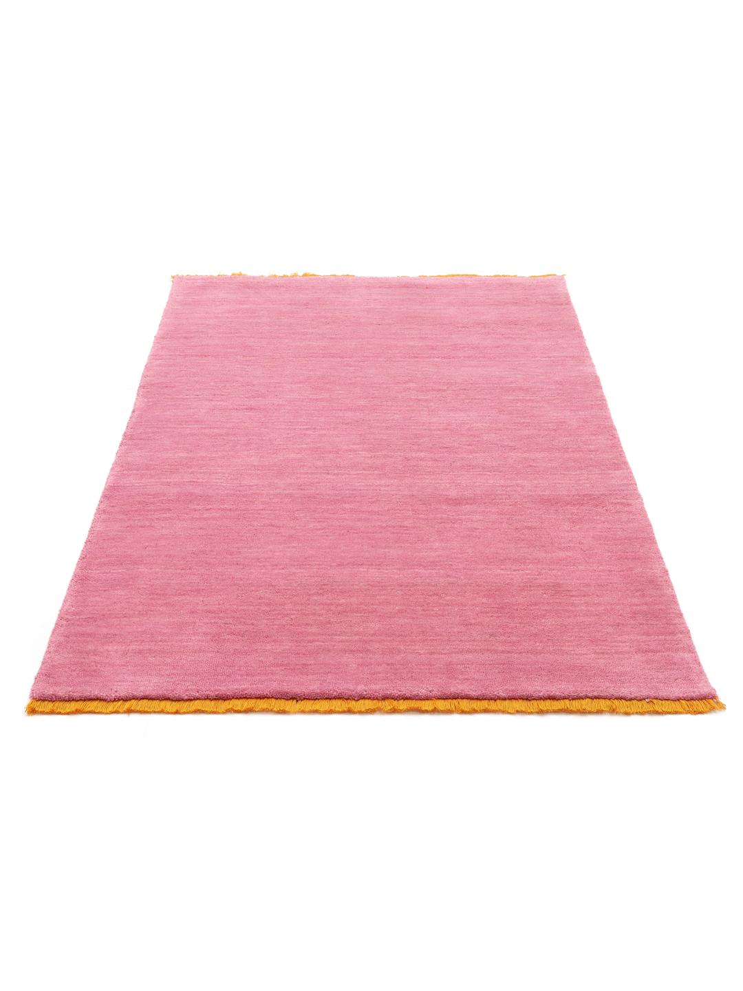 A pink and orange Wool rug with a soft texture.