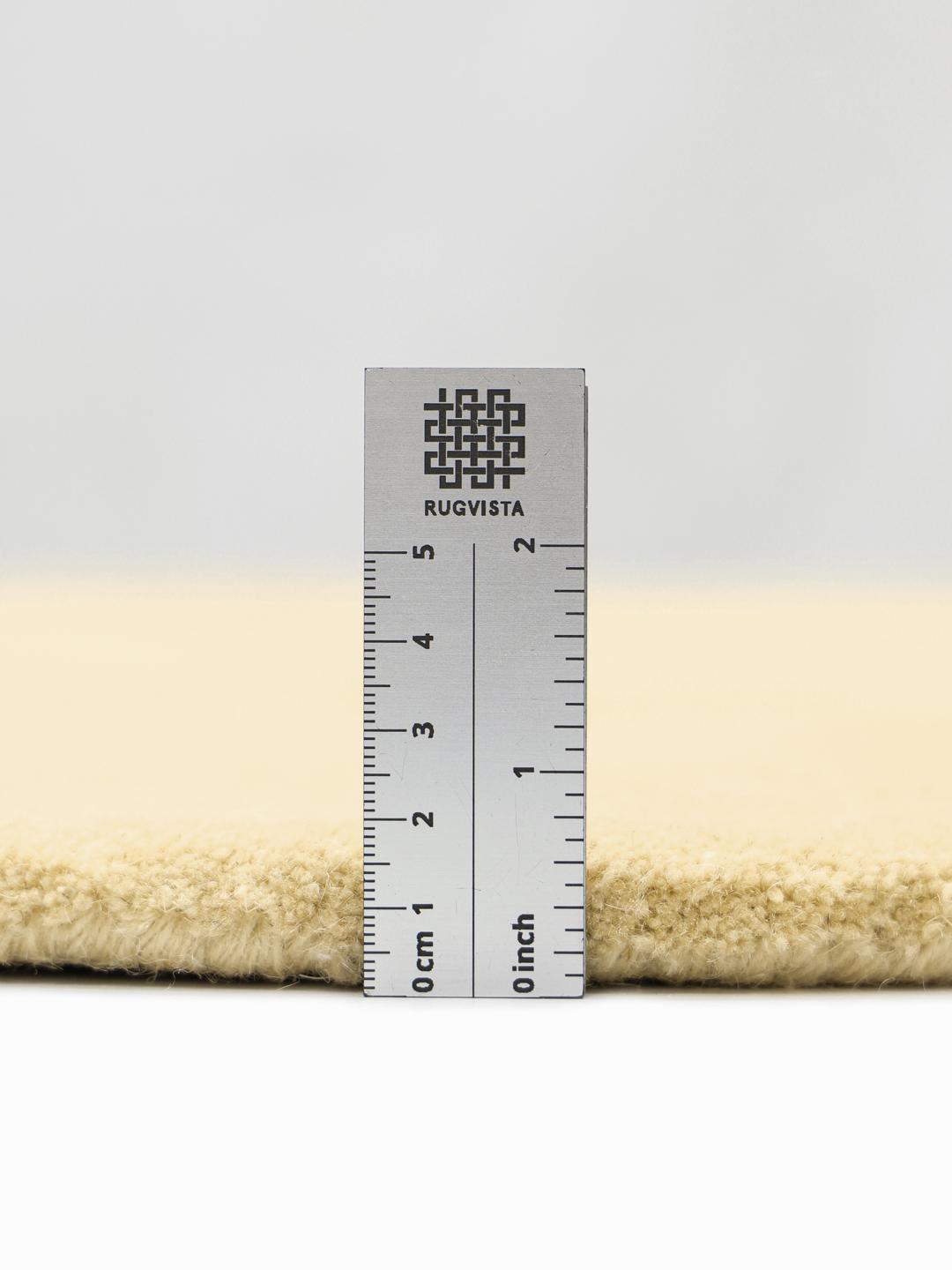 Irregularly shaped yellow Wool rug