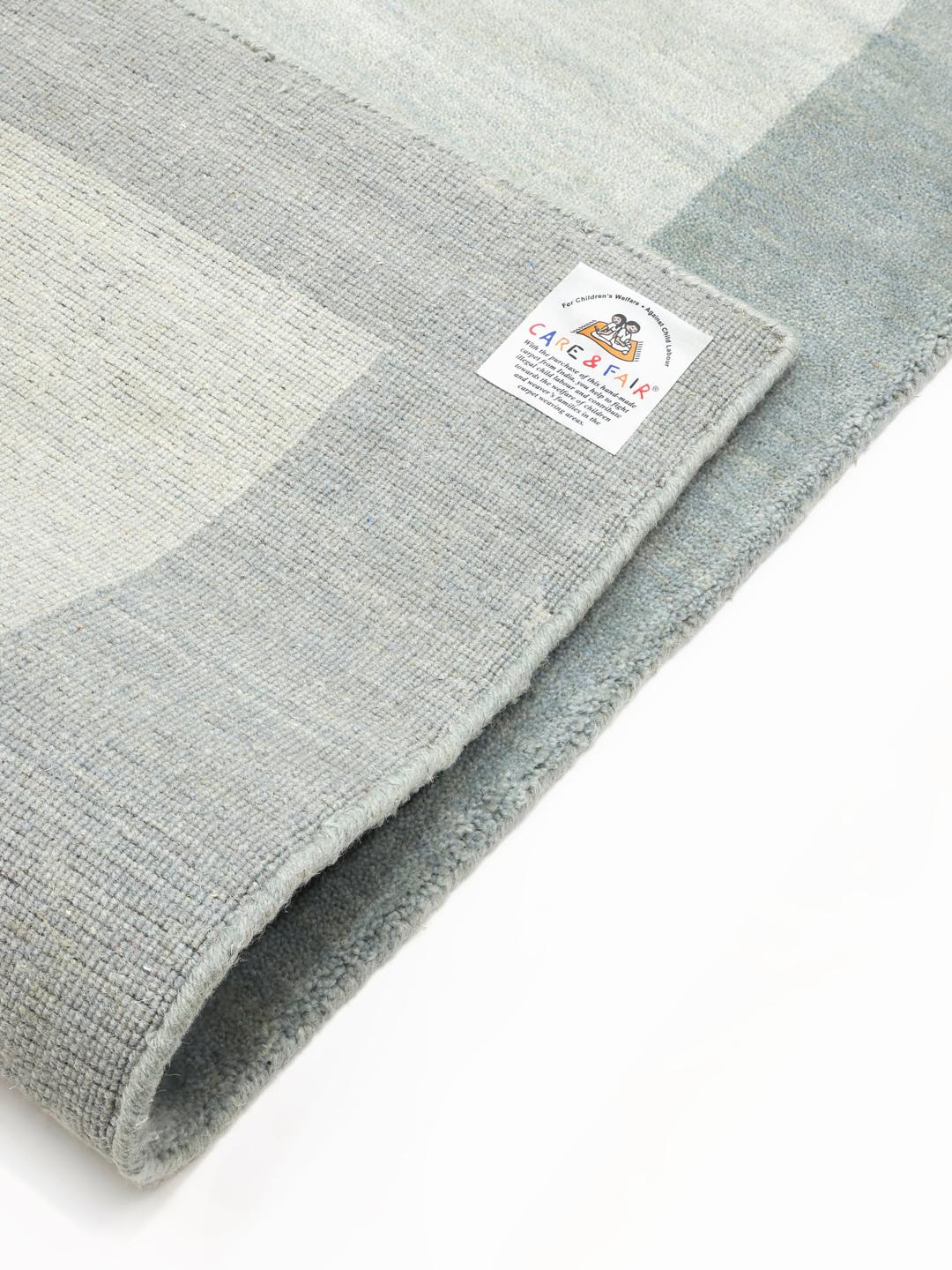 Handloom Frame tæppe i støvblå