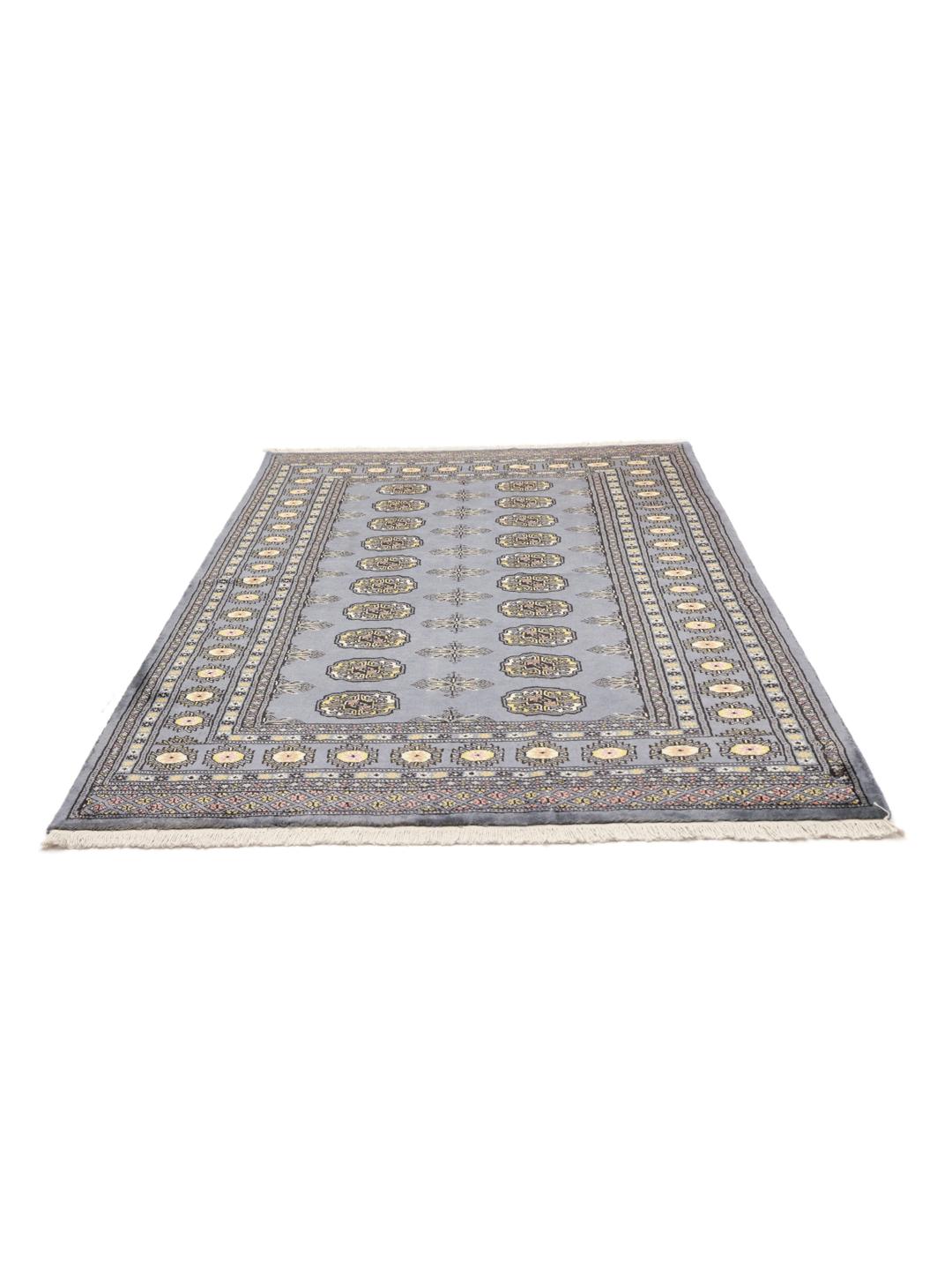 A hand-knotted Pakistan Bokhara rug in grey with traditional medallion motifs.