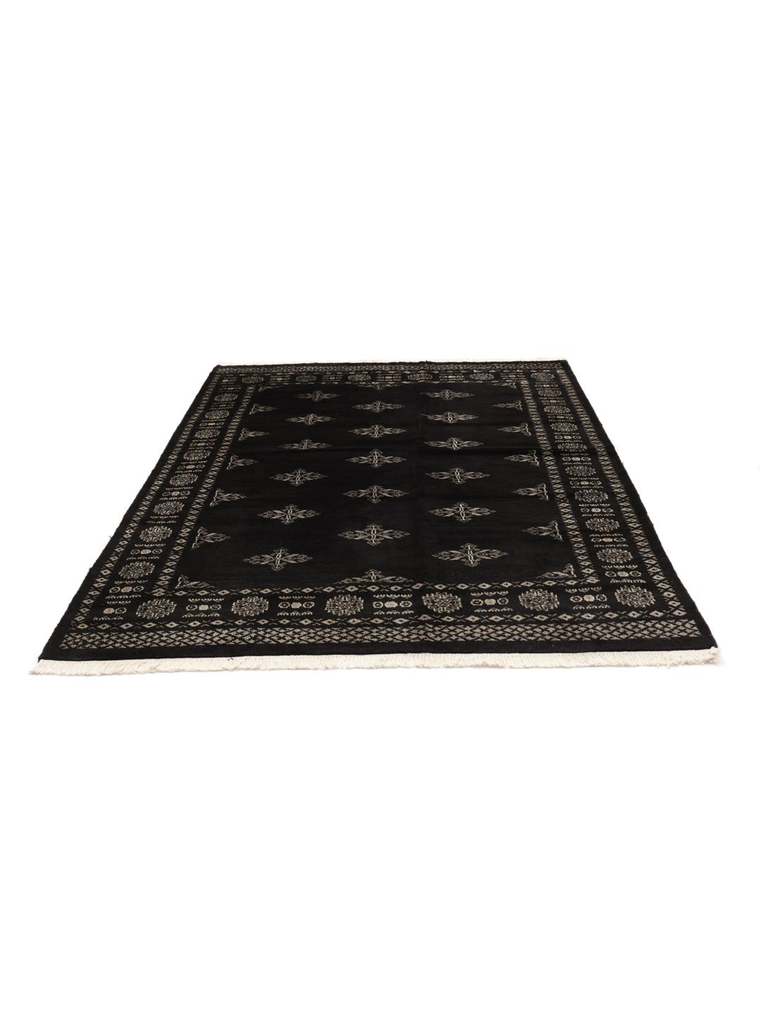 Hand-knotted Pakistani rug in black with repeating geometric motifs