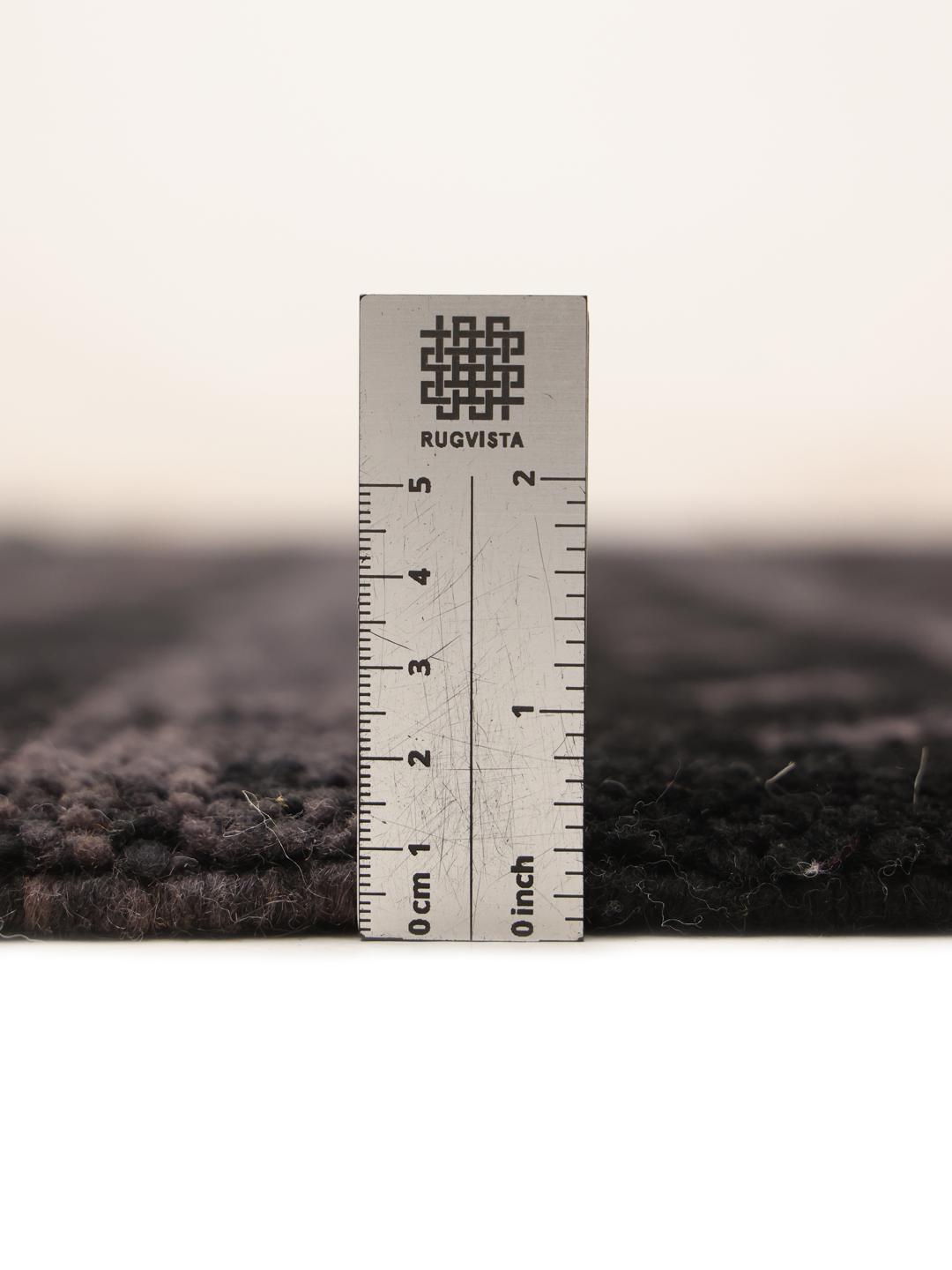 Hand-knotted black Berber Moroccan rug from Morocco featuring subtle horizontal accents.