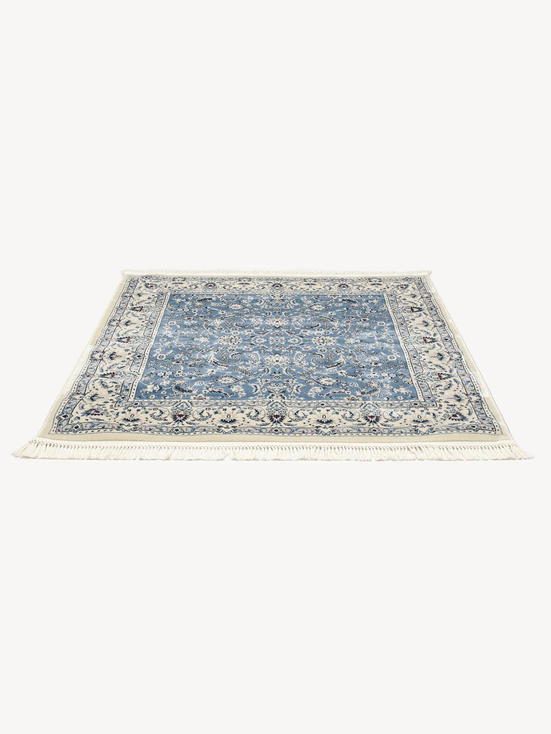 Vierkant lichtblauw vloerkleed met gedetailleerd patroon