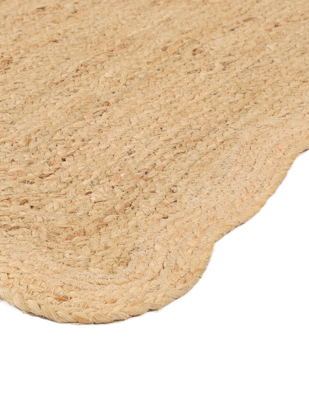 Beige vloerkleed met een golvende rand