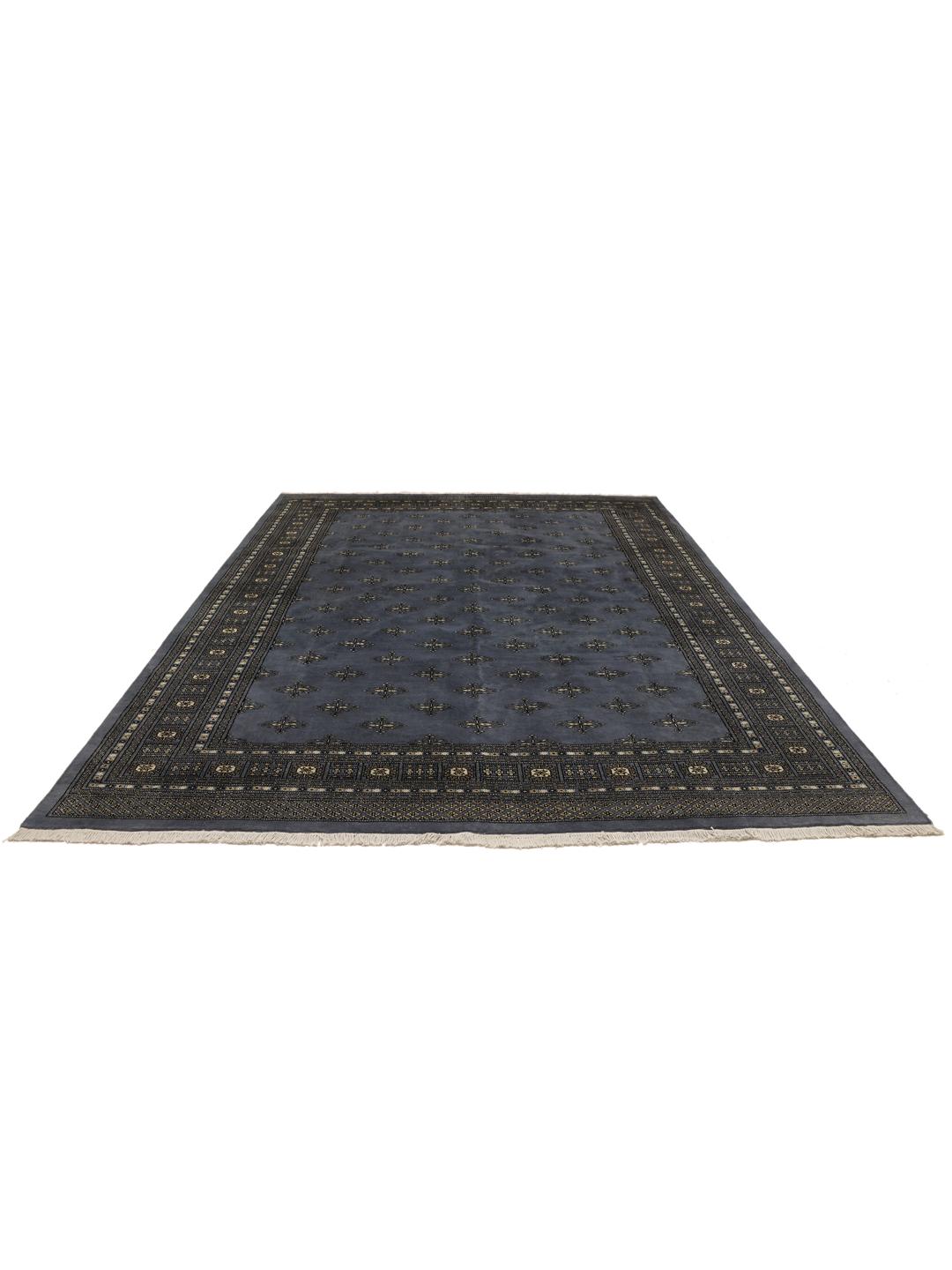 Hand-knotted Pakistani Bokhara rug in deep blue with repeating motifs