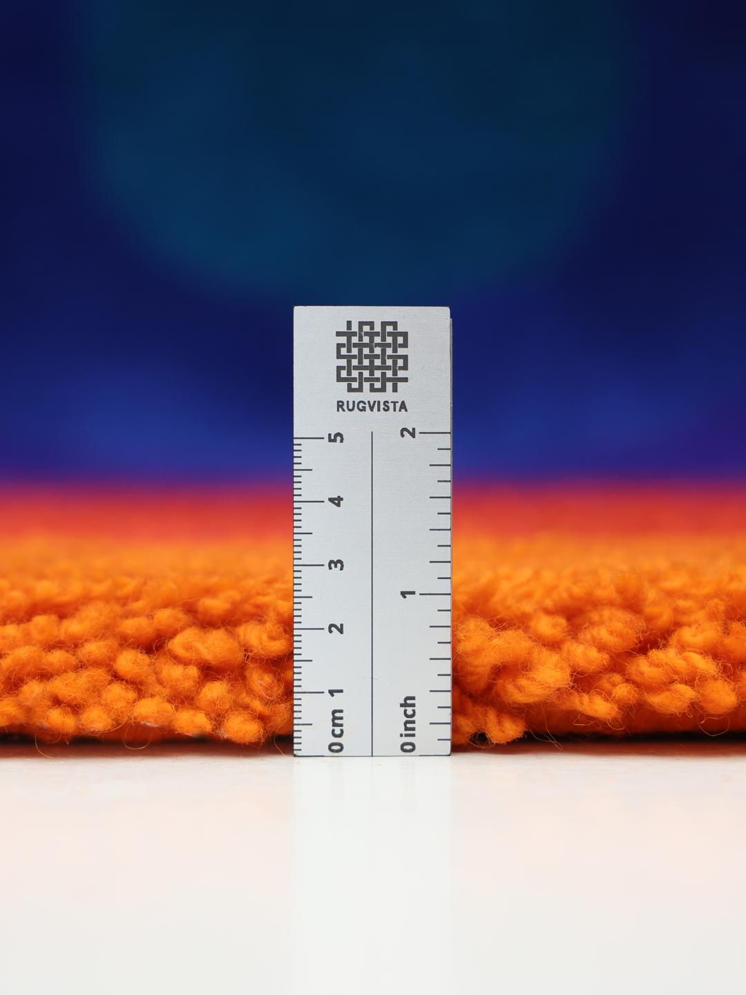 Rond tapijt met concentrische ringen in oranje en meerkleurige tinten