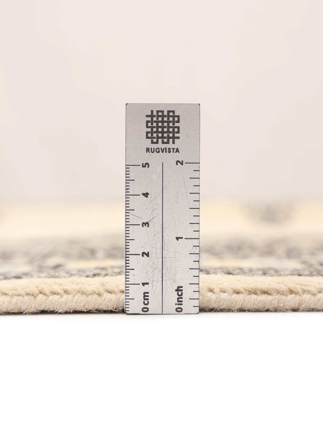 Hand-knotted Pakistani rug with beige field and geometric patterns