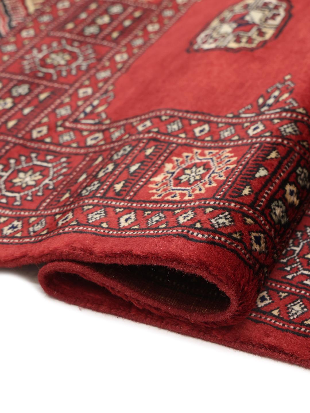 Hand-knotted red Bokhara rug from Pakistan