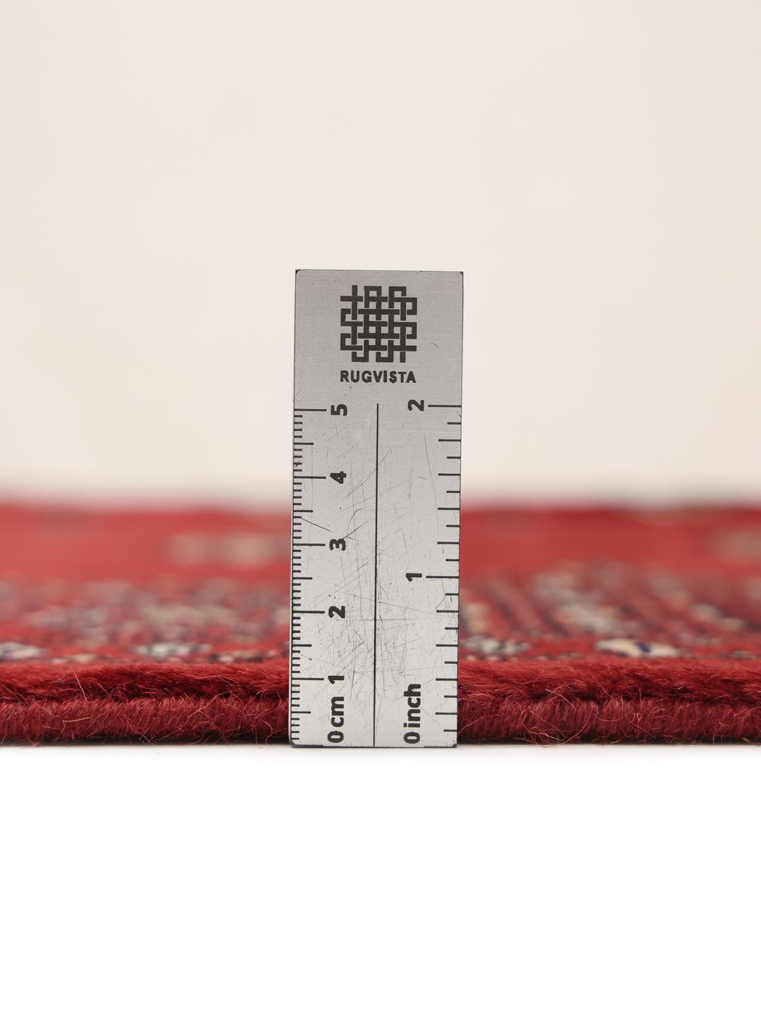 Hand-knotted red Bokhara rug from Pakistan