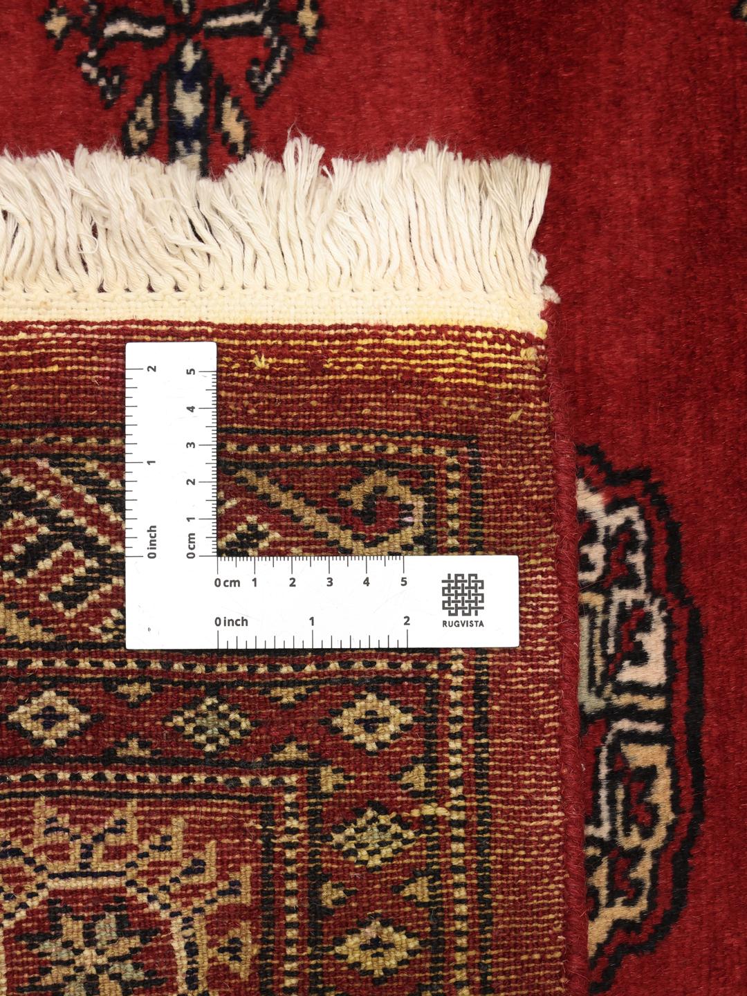 Hand-knotted red Bokhara rug from Pakistan