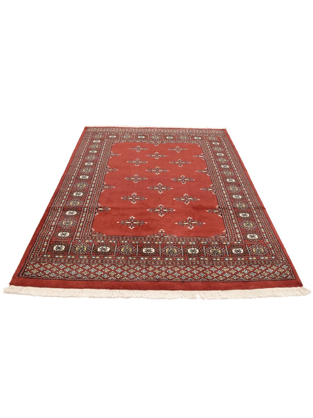 Hand-knotted Pakistani rug with a deep red field and repeating motifs