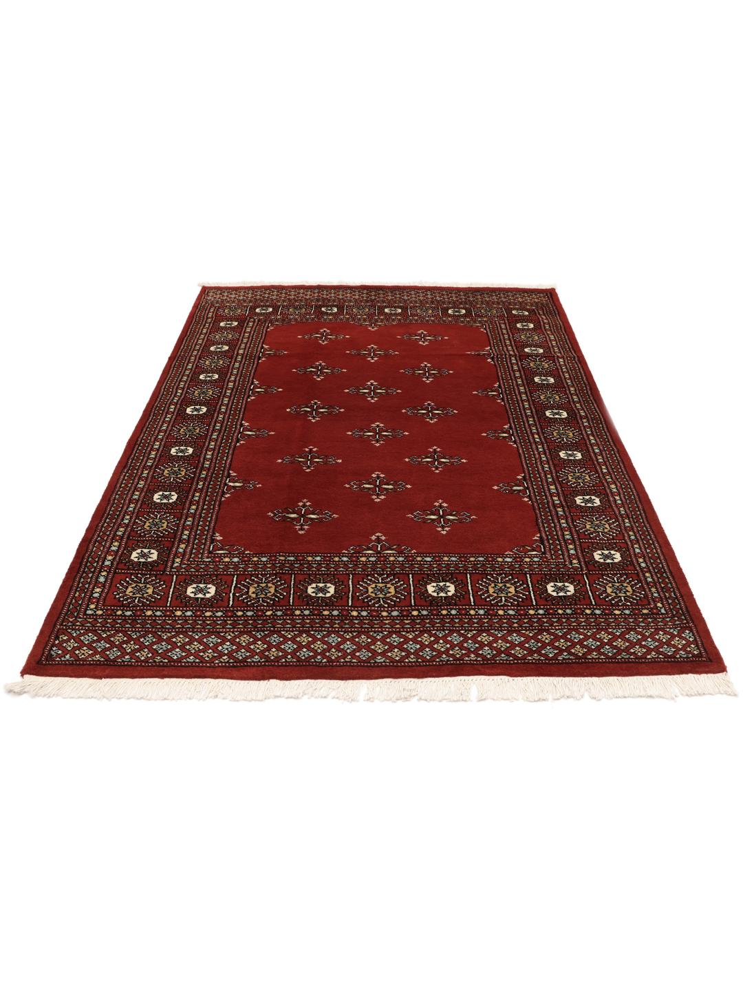 Hand-knotted Pakistani rug with a deep red field and repeating motifs