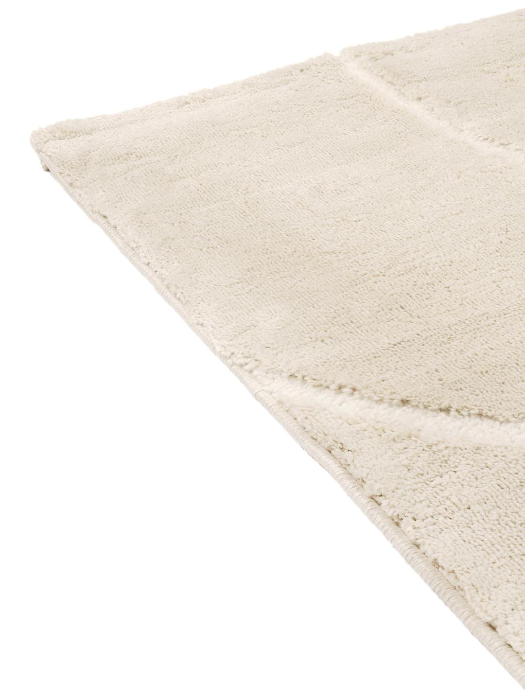crèmewit vloerkleed met uitgesneden lijndetails