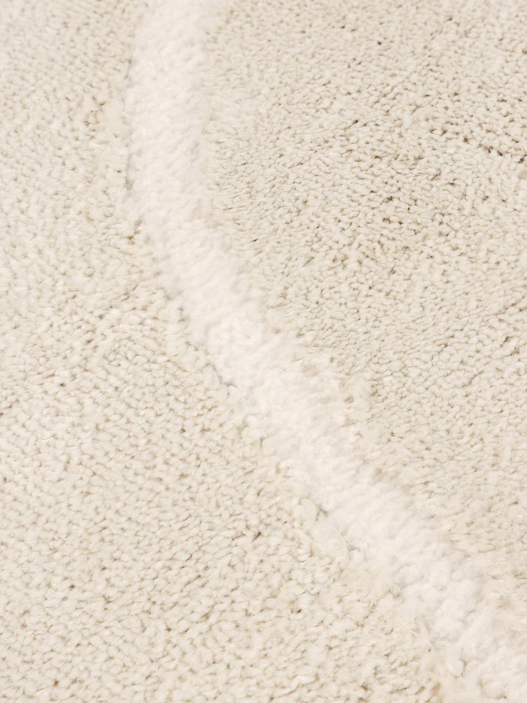 crèmewit vloerkleed met uitgesneden lijndetails