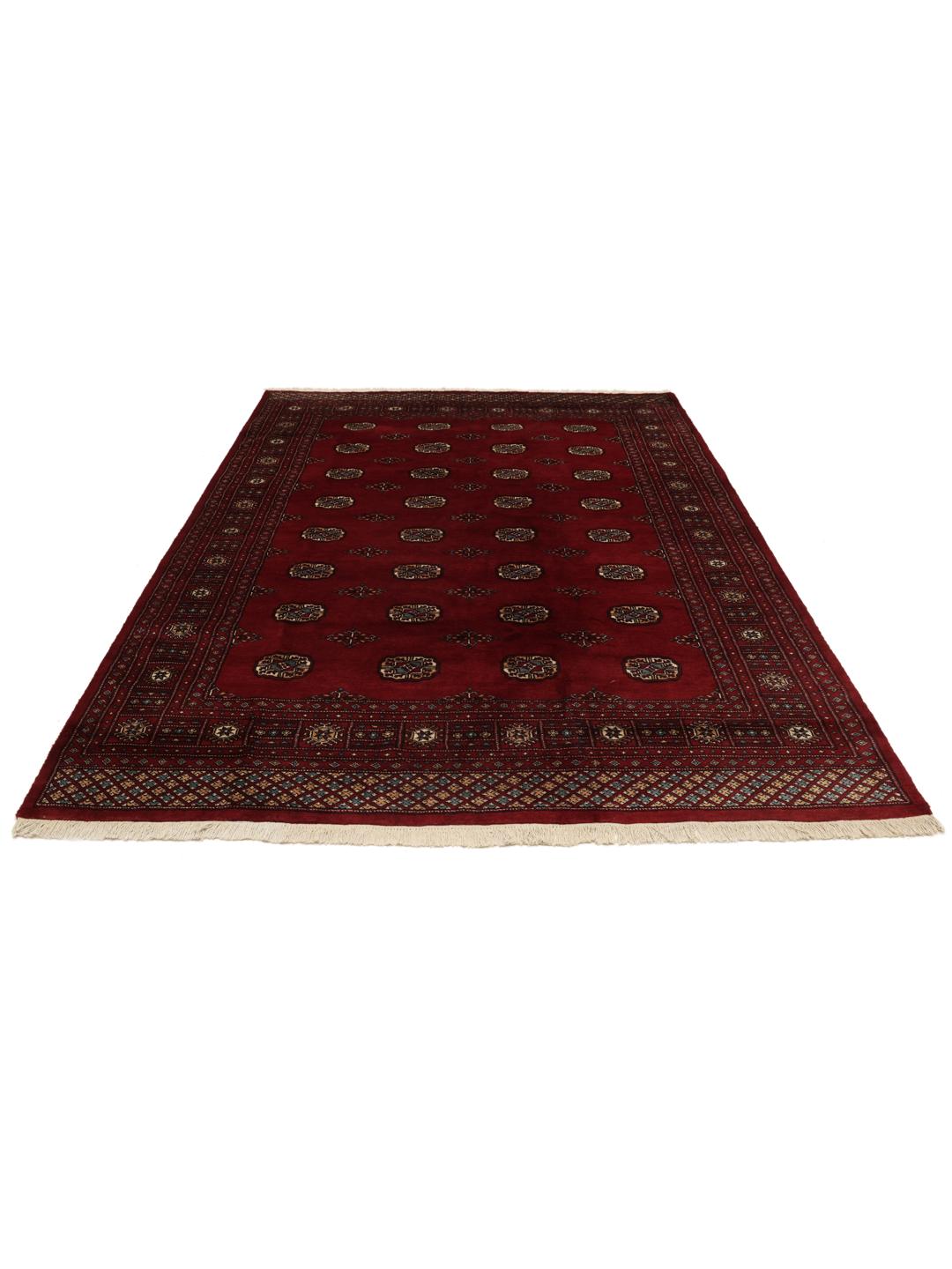 Hand-knotted Pakistani Bokhara rug in a deep red tone with traditional geometric patterns
