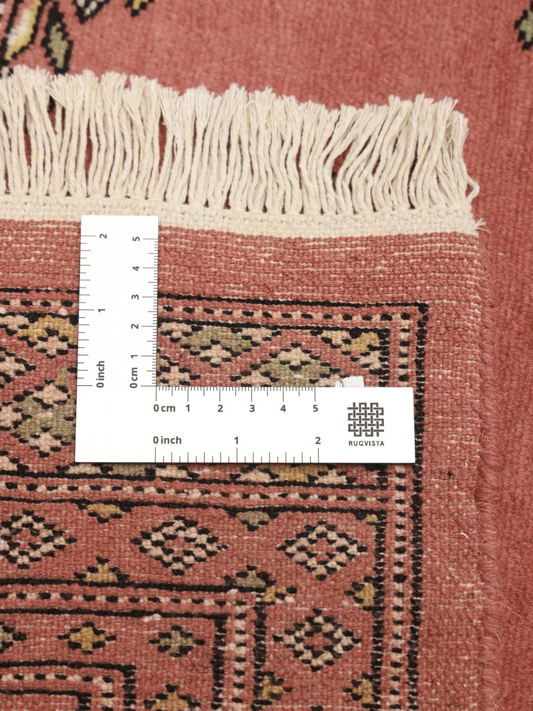 Hand-knotted Pakistani Bokhara rug in dark-red with geometric medallions