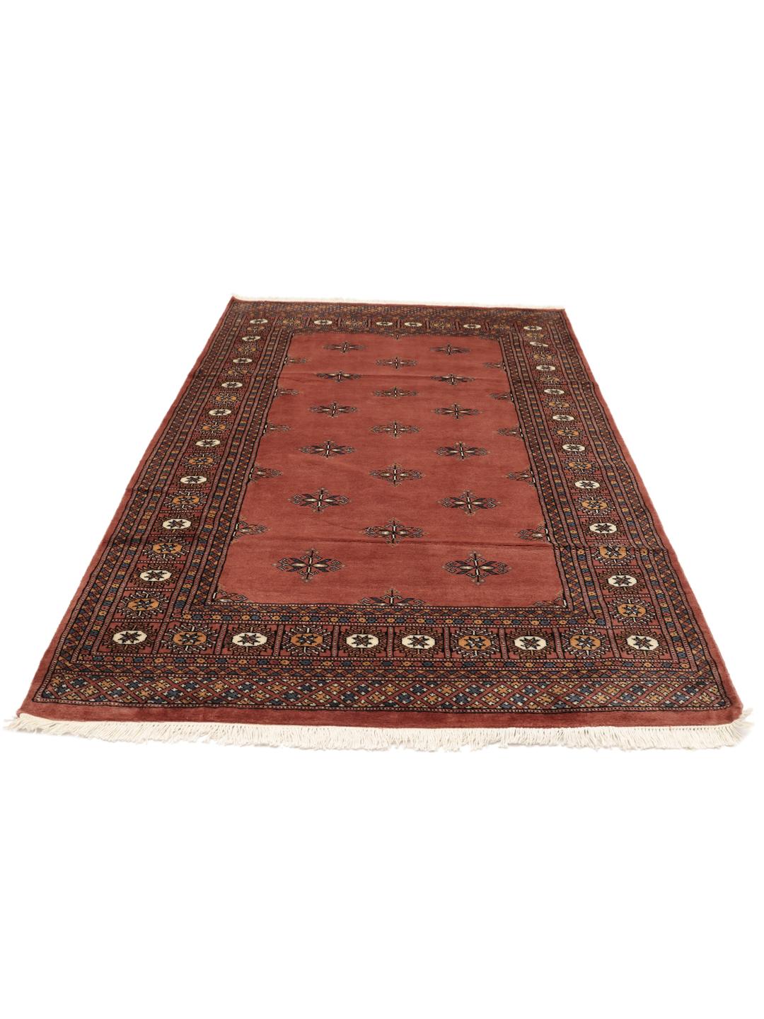 Hand-knotted red Bokhara rug from Pakistan with traditional motifs