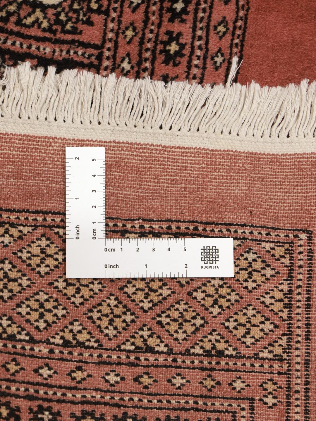 Hand-knotted Pakistan rug with red field and traditional gul motifs