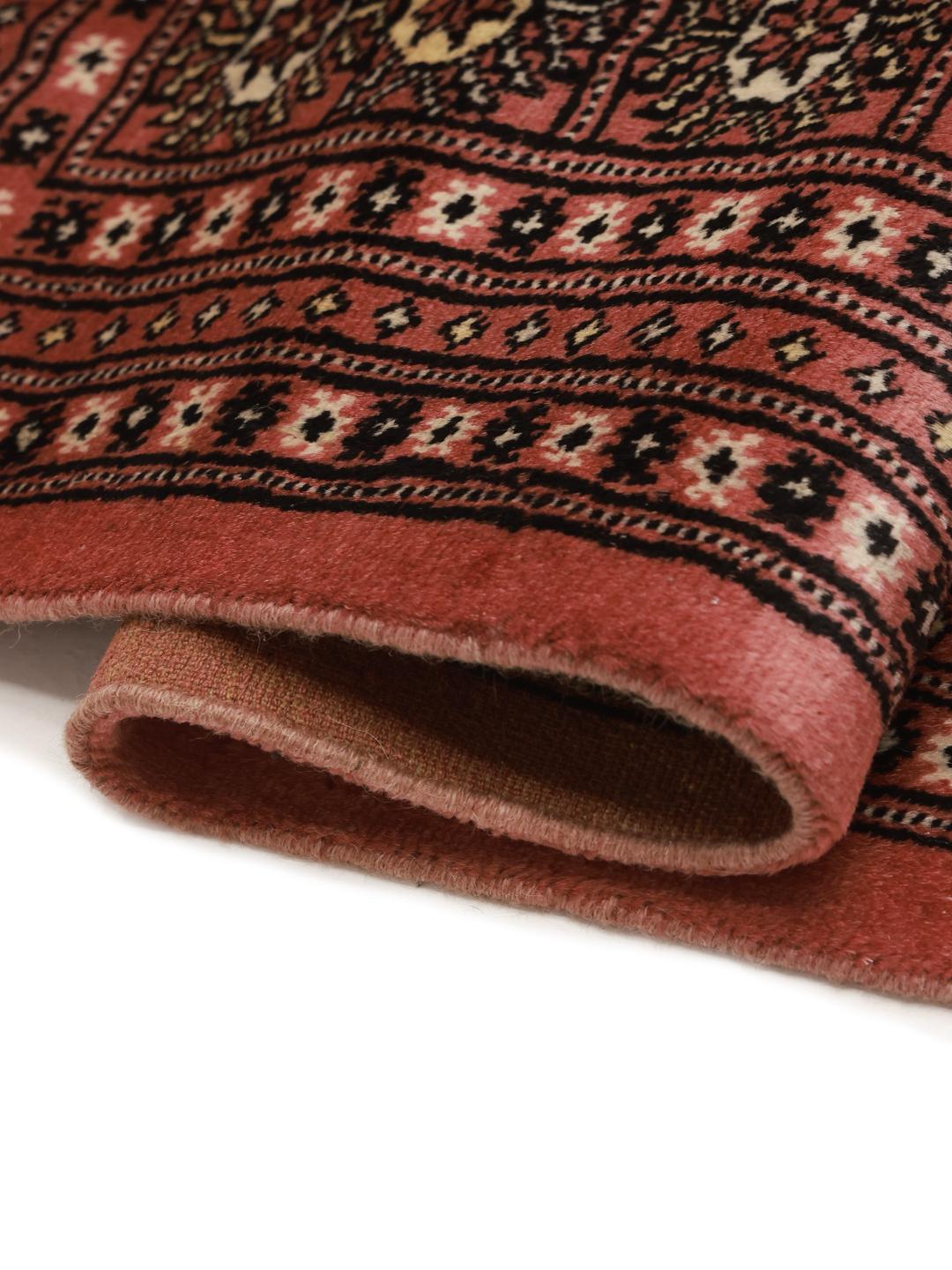 Hand-knotted Pakistan rug with red field and traditional gul motifs