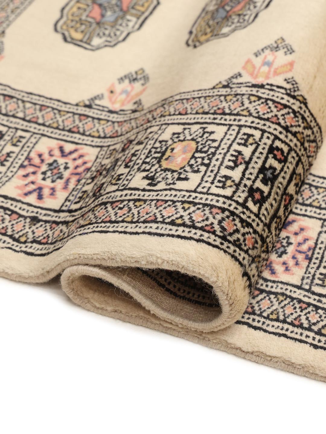 Hand-knotted beige Pakistan runner with a traditional decorative border