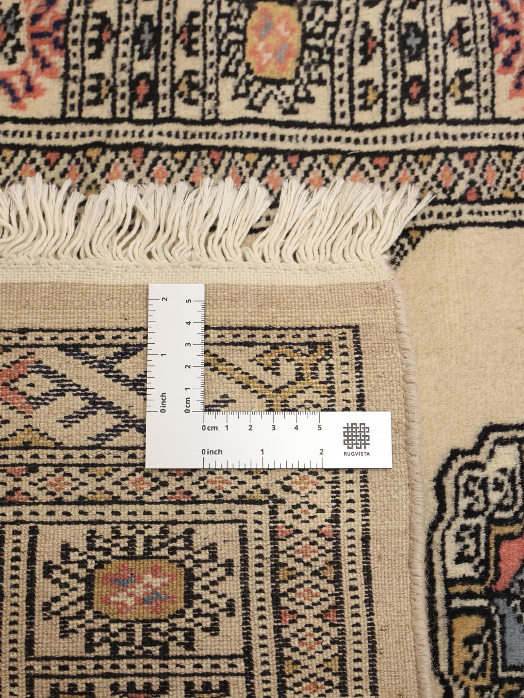 Hand-knotted beige Pakistan runner with a traditional decorative border