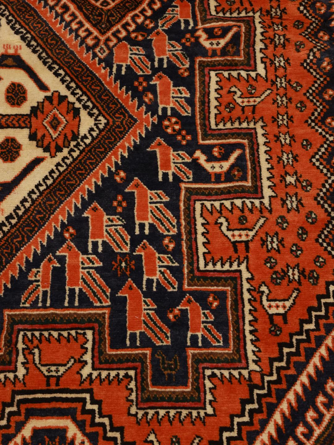 Hand-knotted Afshar rug with red and dark-blue tribal geometric patterns from the Middle East