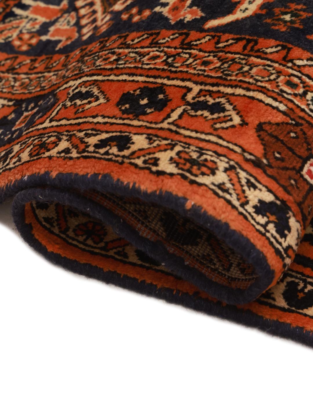 Hand-knotted Afshar rug with red and dark-blue tribal geometric patterns from the Middle East