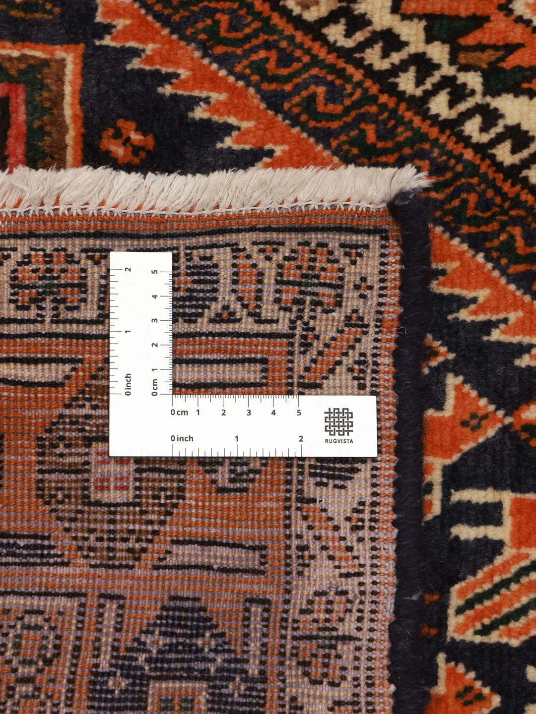 Hand-knotted Afshar rug with red and dark-blue tribal geometric patterns from the Middle East