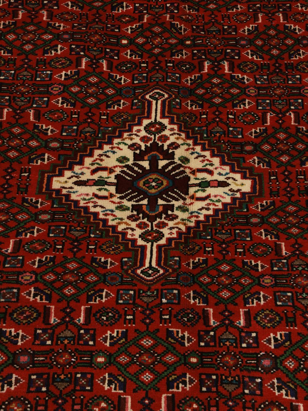 Hand-knotted Hosseinabad rug from the Middle East in dark-red and beige.