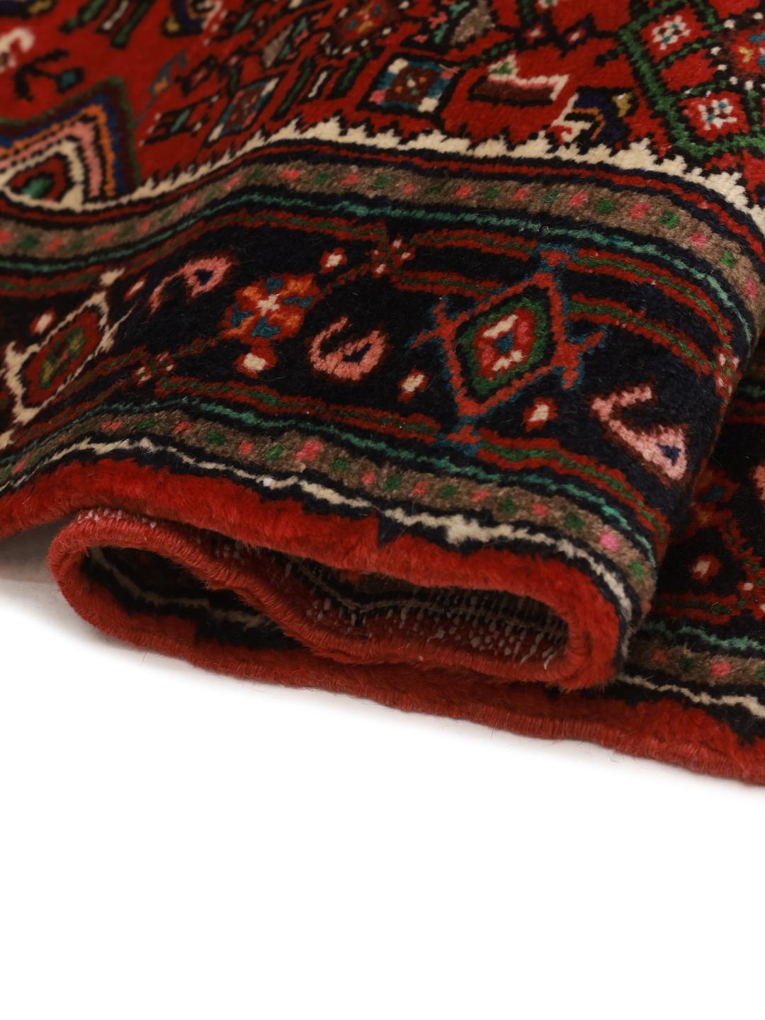 Hand-knotted Hosseinabad rug from the Middle East in dark-red and beige.