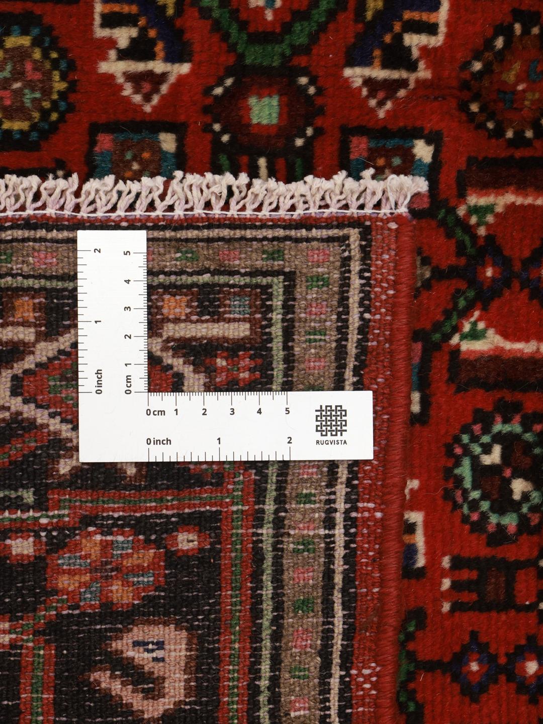 Hand-knotted Hosseinabad rug from the Middle East in dark-red and beige.