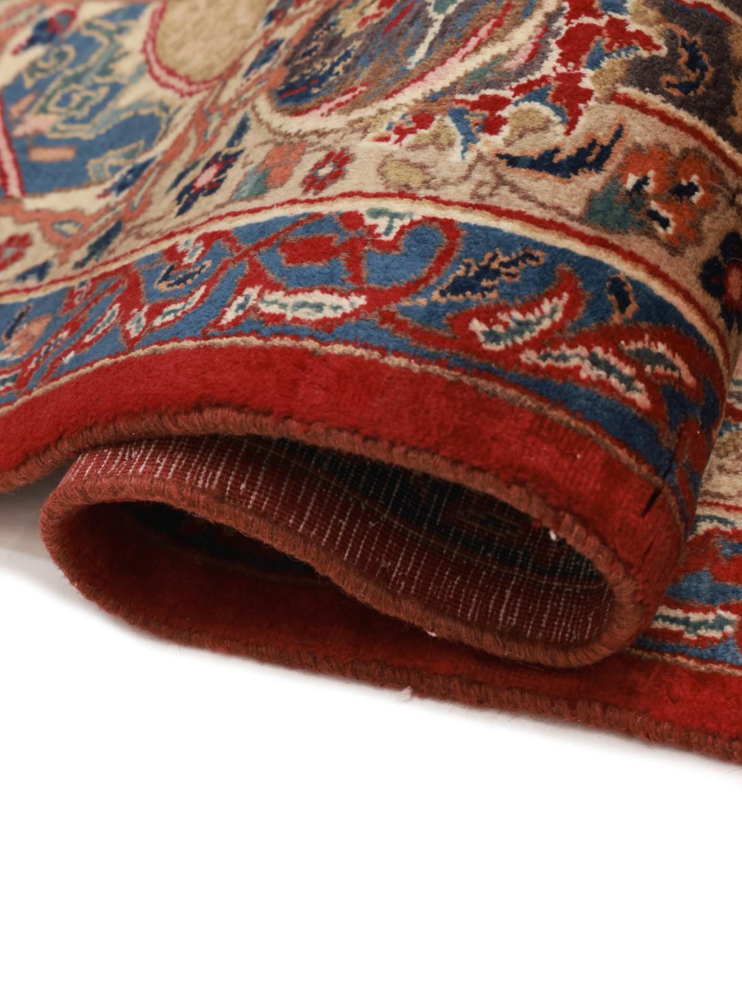 Handgeknoopt Mashad-tapijt uit het Midden-Oosten in dieprode en blauwe tinten