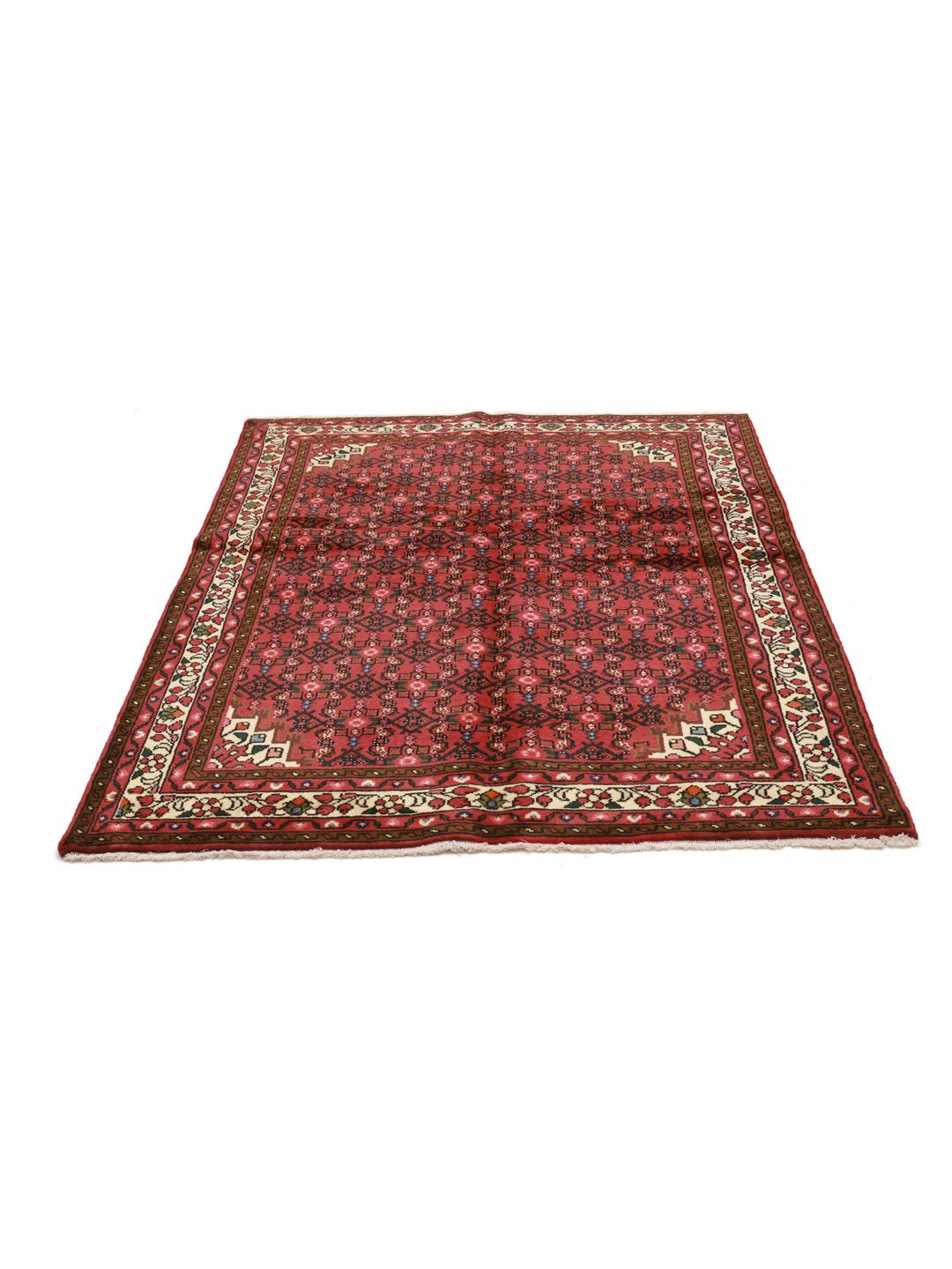 Hand-knotted Hosseinabad rug with a rich red field and traditional Middle Eastern motifs.