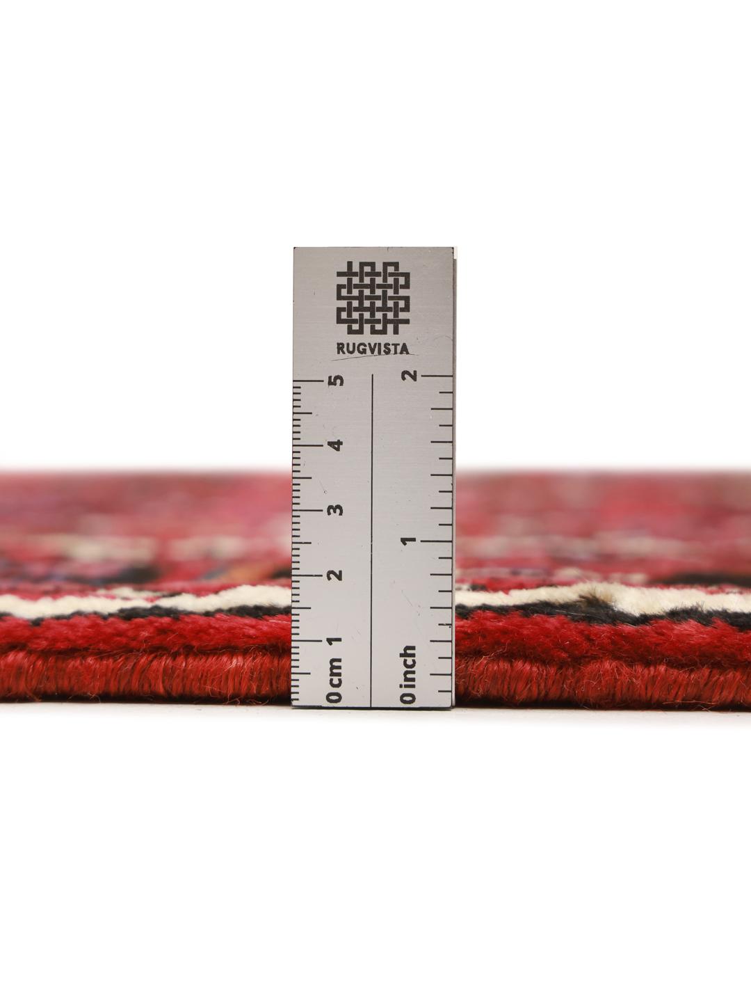 Hand-knotted Hosseinabad Wool rug from the Middle East in red and black colours