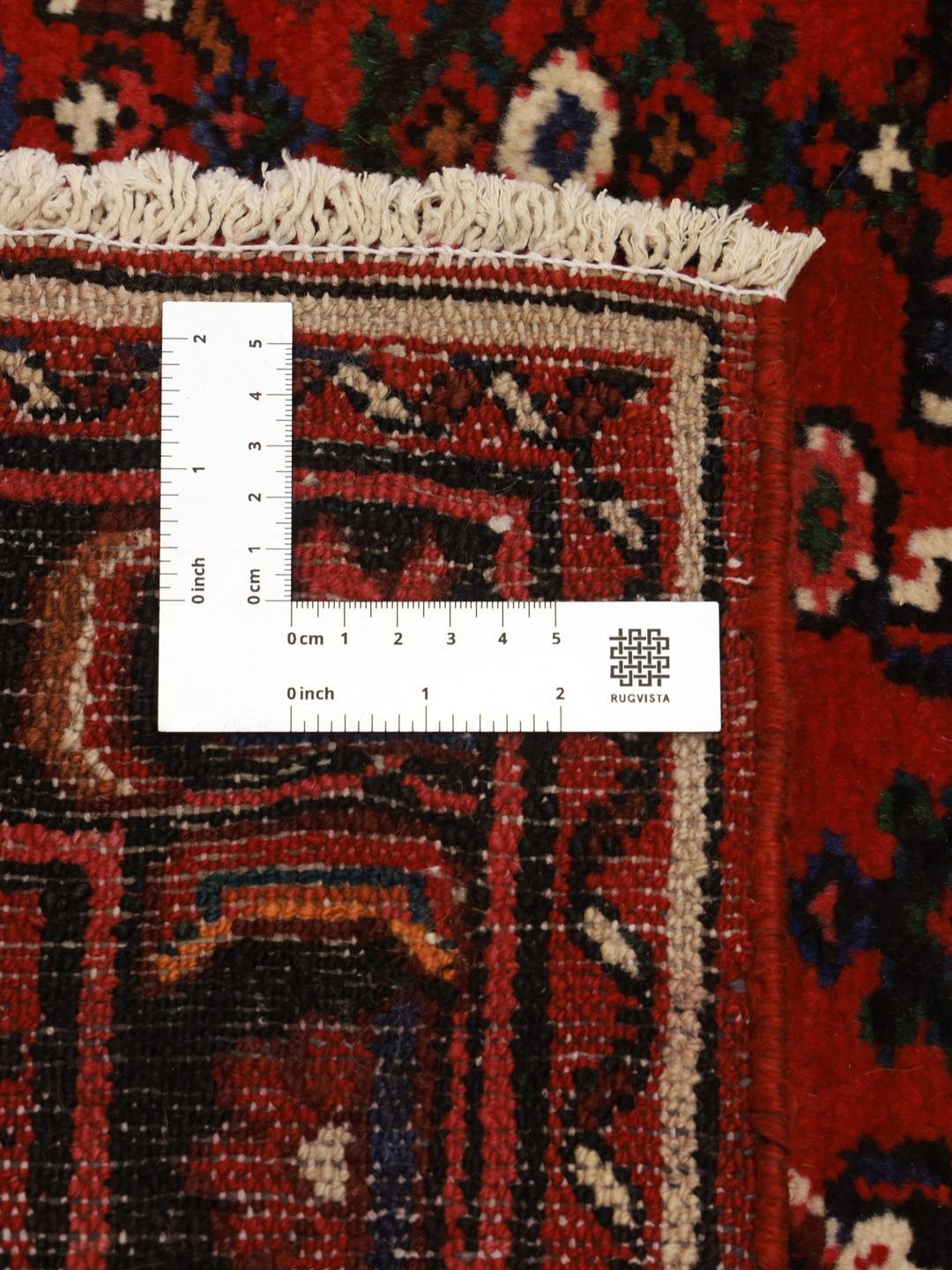 Hand-knotted Hosseinabad Wool rug from the Middle East in red and black colours