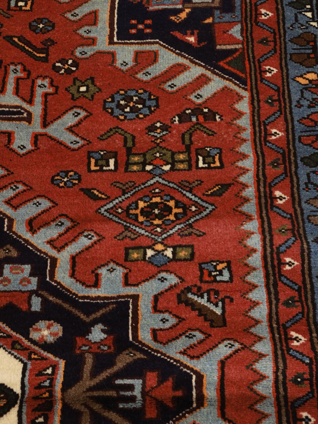 Hand-knotted Hamadan rug with a red and blue medallion design from the Middle East