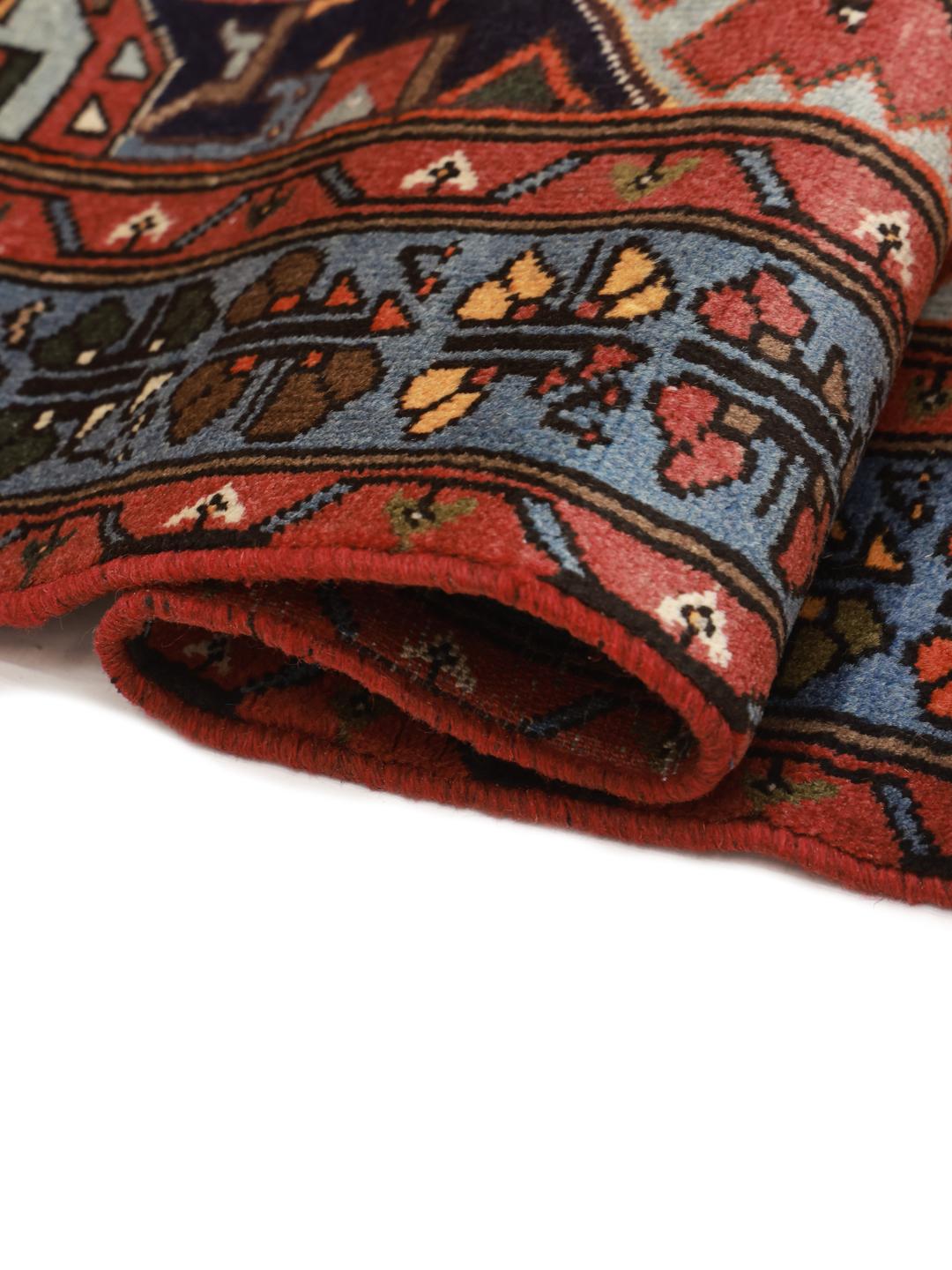 Hand-knotted Hamadan rug with a red and blue medallion design from the Middle East