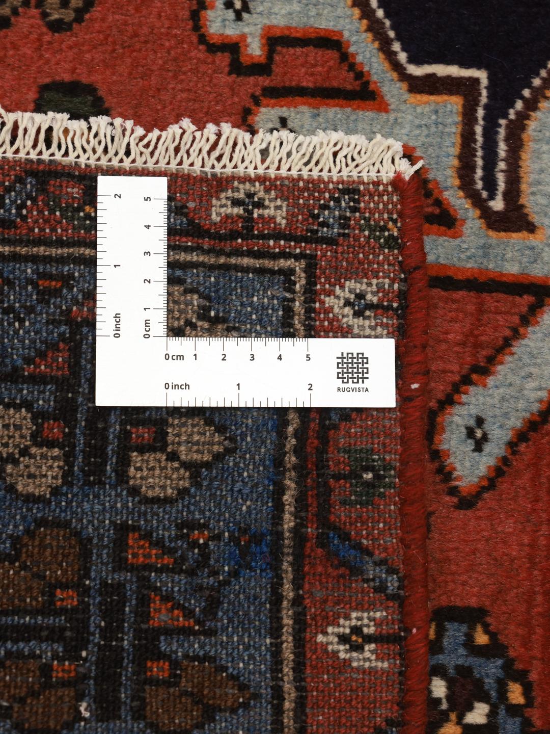 Hand-knotted Hamadan rug with a red and blue medallion design from the Middle East
