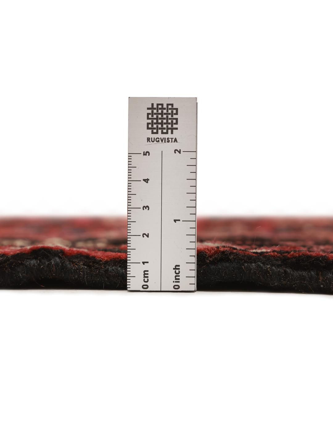 Hand-knotted Hosseinabad rug from the Middle East in dark-red with geometric motifs