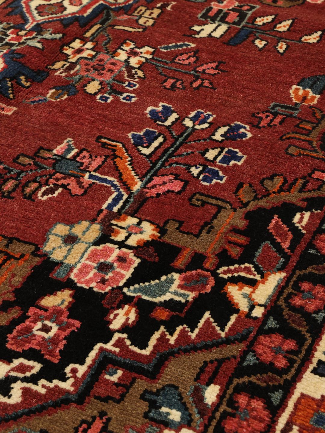 Hand-knotted Hamadan rug from the Middle East in red with a central medallion