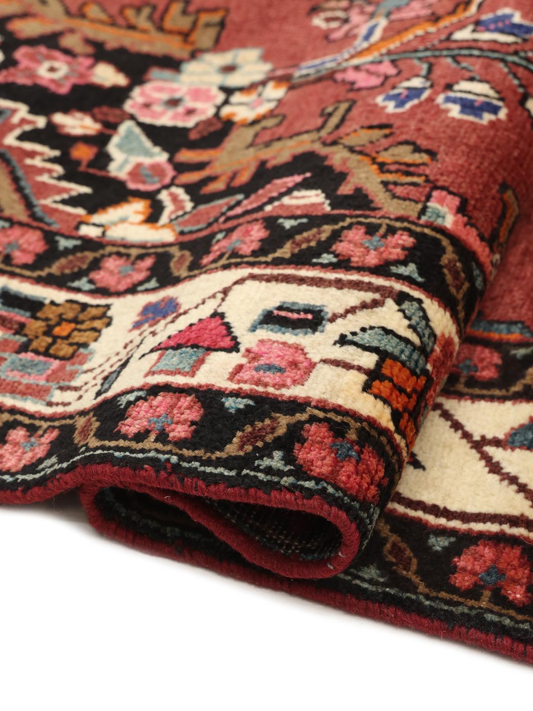 Hand-knotted Hamadan rug from the Middle East in red with a central medallion