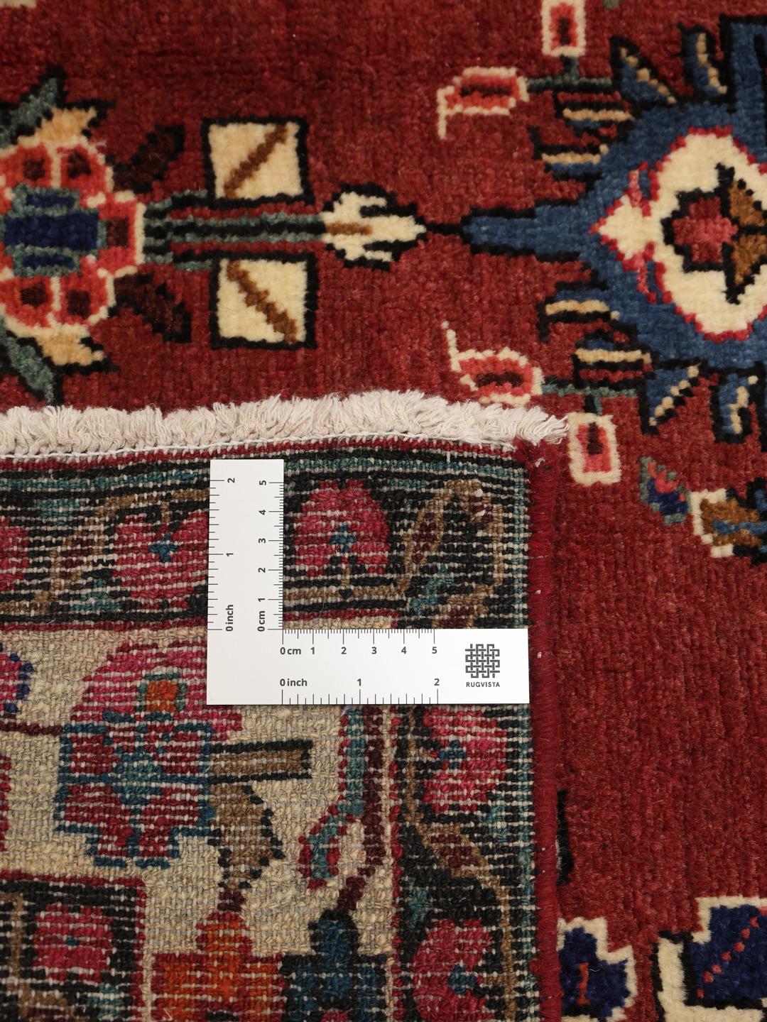 Hand-knotted Hamadan rug from the Middle East in red with a central medallion